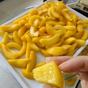 Sweet and Juicy Yellow Peach Slices in Syrup for Desserts